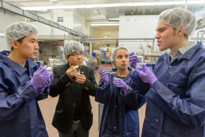 Anh Nguyen ’15 (ENG), left, Anson Ma, assistant professor of chemical and bimolecular engineering, Leonora Yokubinas ’15 (ENG) and Nicholas Fleming ’15 (ENG) taste a test batch of reduced sugar ice cream at the UConn Creamery on April 8, 2015. (Peter Morenus/UConn Photo)